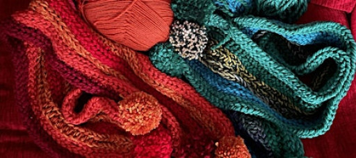 Finger Knit a scarf with Pom Poms. No skill or experience required!